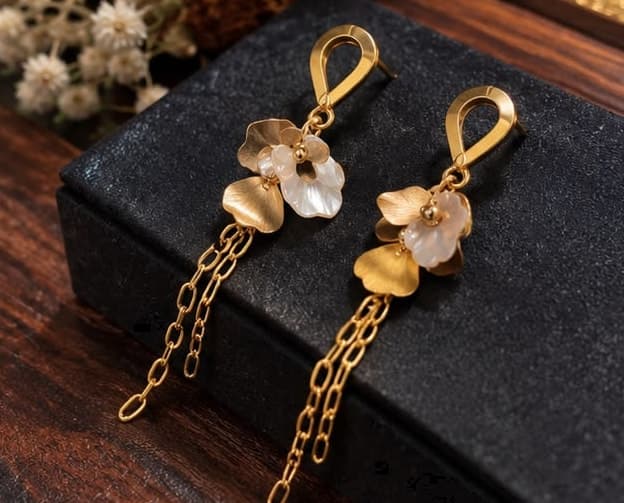 White Petal Chain Earrings, laid flat